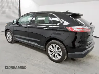 2021 Ford Edge Titanium с VIN 2FMPK4K94MBA27083, выставлен на аукционе Copart как лот 62149285 с пробегом 128 325 миль миль и Чистый • Clean title. История ставок и продаж доступна на DreamBid. Изображение 2.