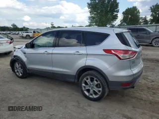 2013 Ford Escape SEL with VIN 1FMCU9HX1DUB15143, listed as a Copart auction lot 56237095 with 127,017 mi miles and Salvage title. Bid and sale history available at DreamBid. Image 2.