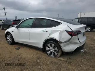 2023 Tesla Model Y Long Range z VIN 7SAYGAEE0PF693613, wystawiony jako Copart lot #54452895 z przebiegiem 19 574 mil mil oraz Szkoda całkowita • Salvage title. Historia ofert i sprzedaży dostępna na DreamBid. Obrazek 2.