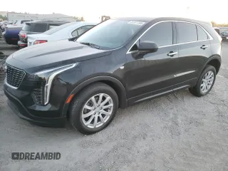 2021 Cadillac XT4 FWD Luxury z VIN 1GYAZAR40MF030909, wystawiony jako Copart lot #87511785 z przebiegiem 21 711 mil mil oraz Szkoda całkowita • Salvage title. Historia ofert i sprzedaży dostępna na DreamBid. Obrazek 1.