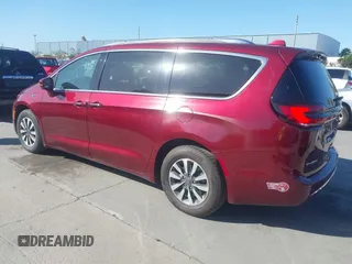 2021 Chrysler Pacifica Hybrid Touring L with VIN 2C4RC1L76MR581285, listed as a IAAI auction lot 42303222 with 77,808 mi miles and . Bid and sale history available at DreamBid. Image 3.
