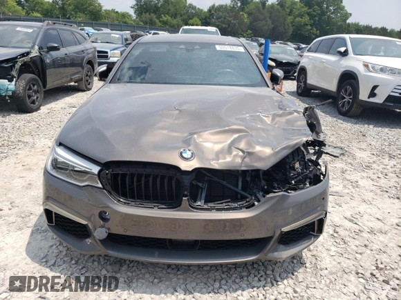 2020 BMW 5 Series M550i xDrive with VIN WBAJS7C08LCD82431, listed as a Copart auction lot 59518835 with 33,184 mi miles and Salvage title. Bid and sale history available at DreamBid. Image 5.