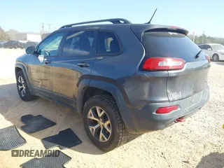 2014 Jeep Cherokee Trailhawk with VIN 1C4PJMBS6EW278987, listed as a IAAI auction lot 41789868 with 136,696 mi miles. Bid and sale history available at carsss.com. Image 3.