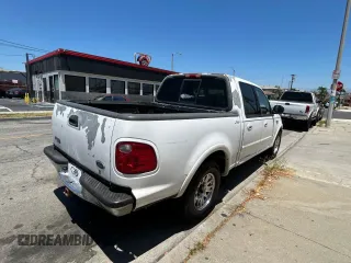 2001 Ford F-150 XLT с VIN 1FTRW07L11KF90642, выставлен на аукционе Copart как лот 64489205 с пробегом 242 959 миль миль и Списание • Salvage title. История ставок и продаж доступна на DreamBid. Изображение 4.