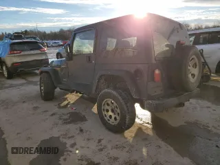 2006 Jeep Wrangler Sport Right Hand Drive with VIN 1J4F449S16P741407, listed as a Copart auction lot 88804015 with 182,059 mi miles and Salvage Title. Bid and sale history available at carsss.com. Image 2.
