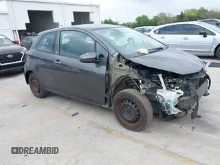 2015 Toyota Yaris L with VIN VNKJTUD32FA017299, listed as a IAAI auction lot 41862473 with 106,108 mi miles. Bid and sale history available at carsss.com. Image 1.