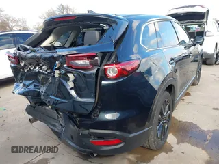 2023 Mazda CX-9 Touring Plus with VIN JM3TCBAY2P0657761, listed as a IAAI auction lot 41125586 with 12,425 mi miles and . Bid and sale history available at DreamBid. Image 4.