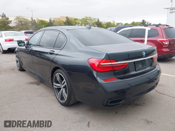2019 BMW 7 Series 750i with VIN WBA7F0C50KGM26010, listed as a IAAI auction lot 42188421 with 71,576 mi miles and . Bid and sale history available at DreamBid. Image 3.