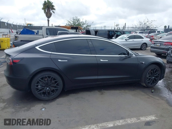 2018 Tesla Model 3 Long Range Battery with VIN 5YJ3E1EA7JF012249, listed as a IAAI auction lot 41782972 with 103,412 mi miles. Bid and sale history available at carsss.com. Image 12.