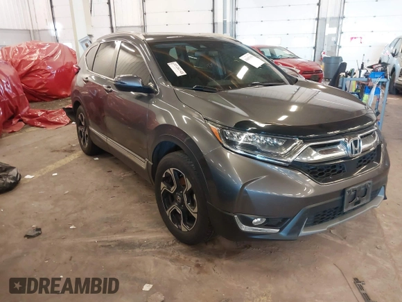 2018 Honda CR-V Touring with VIN 2HKRW2H91JH634457, listed as a IAAI auction lot 41697658 with 101,878 mi miles. Bid and sale history available at carsss.com. Image 1.