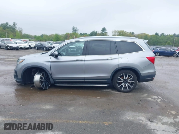 2020 Honda Pilot Touring 8-Passenger z VIN 5FNYF6H91LB042626, wystawiony jako IAAI lot #42249440 z przebiegiem 57 429 mil mil oraz . Historia ofert i sprzedaży dostępna na DreamBid. Obrazek 14.