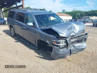 2015 Chevrolet Suburban LT with VIN 1GNSKJKCXFR646433, listed as a IAAI auction lot 42616550 with 124,967 mi miles and . Bid and sale history available at DreamBid. Image 1.
