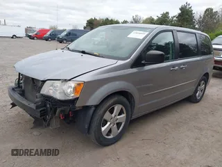 2014 Dodge Grand Caravan American Value with VIN 2C4RDGBG0ER168085, listed as a IAAI auction lot 42020959 with 213,383 mi miles and . Bid and sale history available at DreamBid. Image 2.