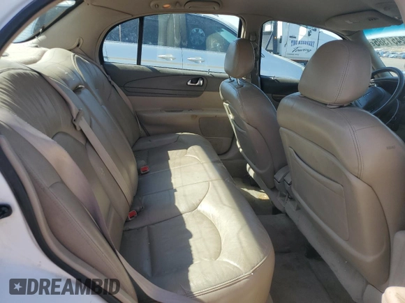 2001 Lincoln Continental z VIN 1LNHM97V31Y673523, wystawiony jako Copart lot #52451385 z przebiegiem 133 879 mil mil oraz Szkoda całkowita • Salvage title. Historia ofert i sprzedaży dostępna na DreamBid. Obrazek 10.