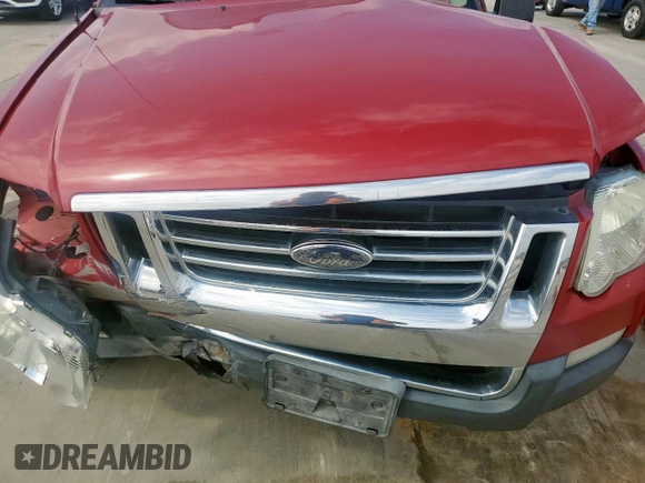 2010 Ford Explorer Sport Trac XLT z VIN 1FMEU3BE4AUF05128, wystawiony jako Copart lot #54847865 z przebiegiem Nie podano mil oraz Szkody całkowita. Historia ofert i sprzedaży dostępna na DreamBid. Obrazek 12.