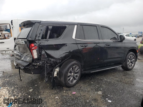 2021 Chevrolet Tahoe LS with VIN 1GNSCMKD4MR335973, listed as a Copart auction lot 69972594 with 42,129 mi miles and Salvage title. Bid and sale history available at DreamBid. Image 3.