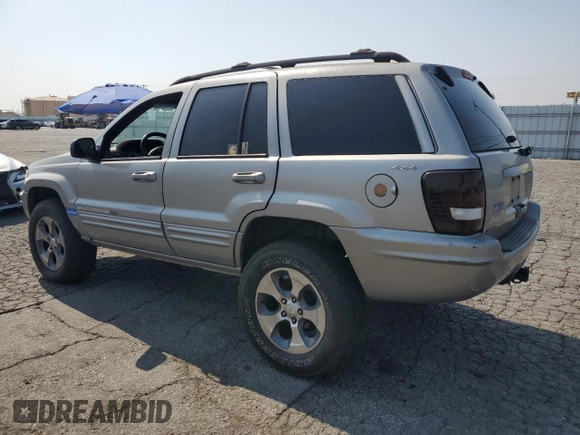 2001 Jeep Grand Cherokee Limited with VIN 1J4GW58N11C721108, listed as a Copart auction lot 60176915 with 257,907 mi miles and Salvage title. Bid and sale history available at DreamBid. Image 2.