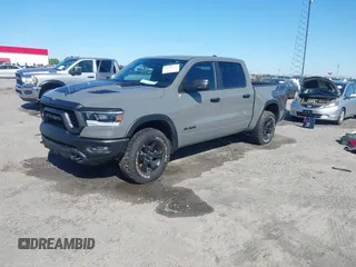2023 Ram 1500 Rebel with VIN 1C6SRFLT2PN677577, listed as a IAAI auction lot 41991668 with 20,507 mi miles and . Bid and sale history available at DreamBid. Image 2.