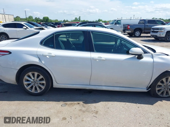 2019 Toyota Camry LE with VIN 4T1B11HK4KU180995, listed as a IAAI auction lot 42088737 with 133,813 mi miles and . Bid and sale history available at DreamBid. Image 14.