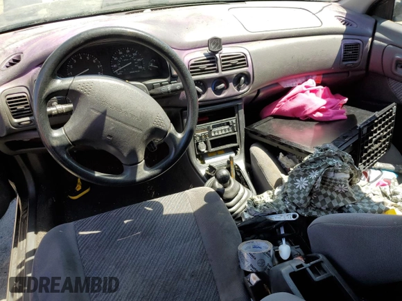 1996 Subaru Impreza Outback with VIN JF1GF4851TG811571, listed as a Copart auction lot 65650514 with 248,315 mi miles and Salvage title. Bid and sale history available at DreamBid. Image 8.