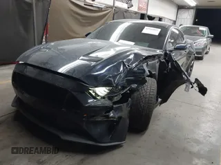 2021 Ford Mustang EcoBoost with VIN 1FA6P8TH0M5110017, listed as a IAAI auction lot 41949095 with 50,321 mi miles and . Bid and sale history available at DreamBid. Image 2.