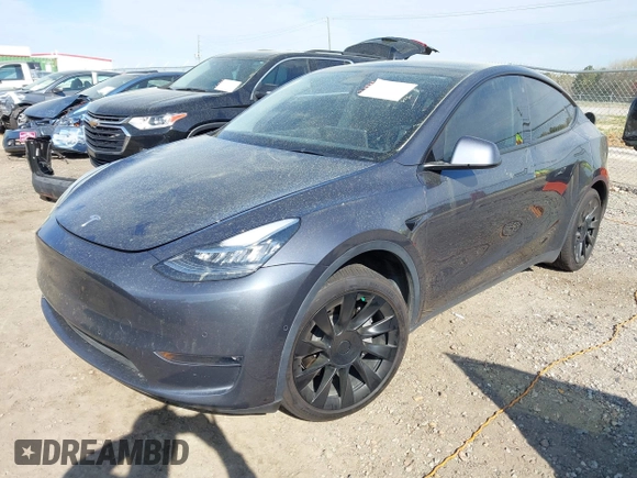 2022 Tesla Model Y Long Range z VIN 7SAYGDEE7NA006476, wystawiony jako IAAI lot #41894606 z przebiegiem 63 380 mil mil oraz . Historia ofert i sprzedaży dostępna na DreamBid. Obrazek 2.