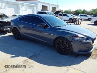 2021 Mazda 6 Carbon Edition with VIN JM1GL1WY4M1619533, listed as a IAAI auction lot 41979213 with 84,783 mi miles and . Bid and sale history available at DreamBid. Image 1.