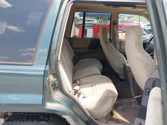 1995 Jeep Grand Cherokee Laredo with VIN 1J4FX58S0SC716398, listed as a IAAI auction lot 42647346 with 58,184 mi miles and . Bid and sale history available at DreamBid. Image 8.
