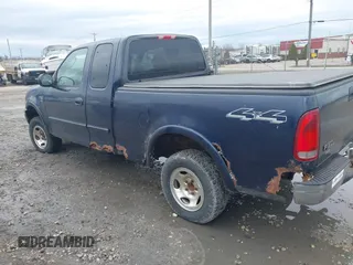 2003 Ford F-150 XL with VIN 1FTRX18W23NB34680, listed as a IAAI auction lot 42089079 with 1 mi miles. Bid and sale history available at carsss.com. Image 3.