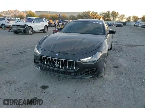 2019 Maserati Ghibli z VIN ZAM57XSA3K1325881, wystawiony jako Copart lot #80973694 z przebiegiem 64 189 mil mil oraz Szkoda całkowita • Salvage title. Historia ofert i sprzedaży dostępna na DreamBid. Obrazek 11.