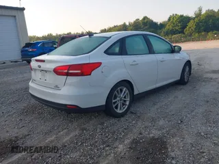2016 Ford Focus SE z VIN 1FADP3F22GL355984, wystawiony jako IAAI lot #42564516 z przebiegiem 128 002 mil mil oraz . Historia ofert i sprzedaży dostępna na DreamBid. Obrazek 4.