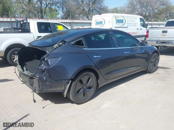 2018 Tesla Model 3 Long Range Battery with VIN 5YJ3E1EA4JF157782, listed as a IAAI auction lot 41774169 with 123,239 mi miles. Bid and sale history available at carsss.com. Image 4.