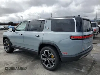 2024 Rivian R1S Adventure with VIN 7PDSGABA7RN038477, listed as a Copart auction lot 48711345 with 0 mi miles and Salvage Title. Bid and sale history available at carsss.com. Image 2.