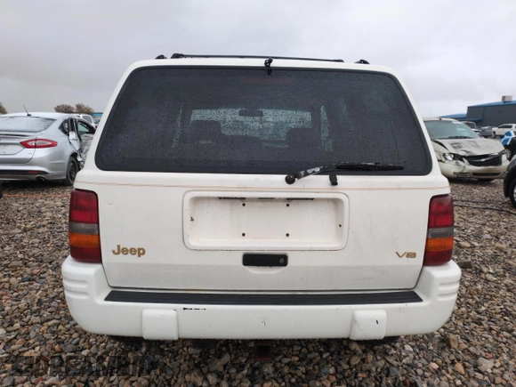 1996 Jeep Grand Cherokee Limited with VIN 1J4GZ78Y0TC185669, listed as a Copart auction lot 79032274 with 184,929 mi miles and Salvage Title. Bid and sale history available at carsss.com. Image 6.