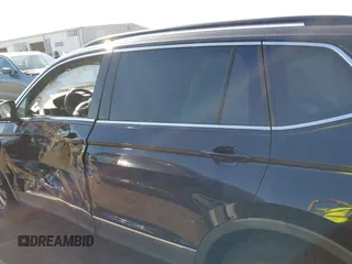 2018 Volkswagen Tiguan SEL z VIN 3VV2B7AX9JM142564, wystawiony jako IAAI lot #40630666 z przebiegiem 86 040 mil mil oraz . Historia ofert i sprzedaży dostępna na DreamBid. Obrazek 14.