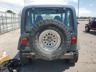 2000 Jeep Wrangler Sport с VIN 1J4FA49S4YP710633, выставлен на аукционе Copart как лот 65095875 с пробегом 107 613 миль миль и Чистый • Clean title. История ставок и продаж доступна на DreamBid. Изображение 6.