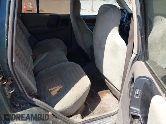1994 Jeep Grand Cherokee Laredo with VIN 1J4GZ58S2RC118502, listed as a IAAI auction lot 42701778 with 420,559 mi miles and . Bid and sale history available at DreamBid. Image 8.