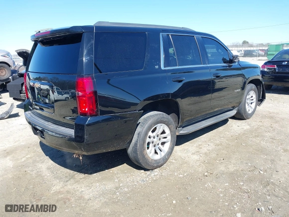 2018 Chevrolet Tahoe LT with VIN 1GNSCBKC7JR254859, listed as a IAAI auction lot 41620074 with 124,714 mi miles. Bid and sale history available at carsss.com. Image 4.