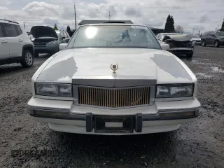 1991 Cadillac Eldorado z VIN 1G6EL13B9MU604115, wystawiony jako Copart lot #52232425 z przebiegiem 95 570 mil mil oraz Szkody całkowita. Historia ofert i sprzedaży dostępna na DreamBid. Obrazek 5.
