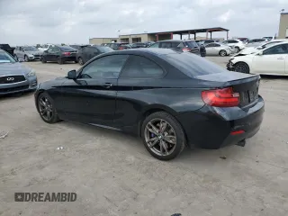 2015 BMW 2 Series M235i with VIN WBA1J7C50FV254060, listed as a Copart auction lot 43622085 with 61,397 mi miles and Salvage Title. Bid and sale history available at carsss.com. Image 2.