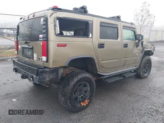 2005 Hummer H2 SUV with VIN 5GRGN23U35H130615, listed as a IAAI auction lot 41085325 with 138,393 mi miles. Bid and sale history available at carsss.com. Image 4.