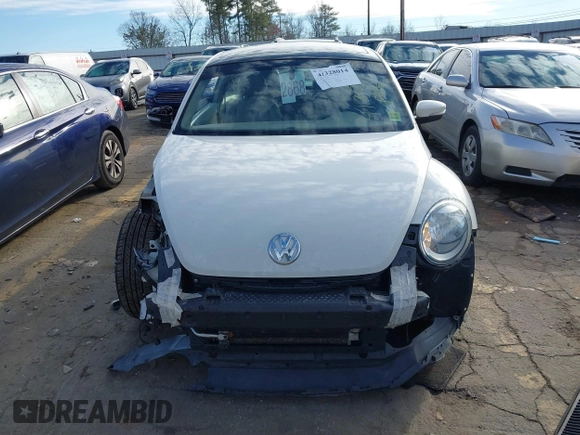 2014 Volkswagen Beetle 2.5L w/Sun with VIN 3VWJP7ATXEM628666, listed as a IAAI auction lot 41328014 with 70,990 mi miles and . Bid and sale history available at DreamBid. Image 13.