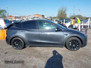 2021 Tesla Model Y Long Range with VIN 5YJYGAEE1MF149887, listed as a IAAI auction lot 42032104 with 54,932 mi miles. Bid and sale history available at carsss.com. Image 13.