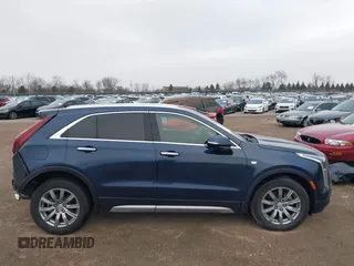 2021 Cadillac XT4 FWD Premium Luxury with VIN 1GYFZCR41MF041306, listed as a IAAI auction lot 41143747 with 53,116 mi miles. Bid and sale history available at carsss.com. Image 13.