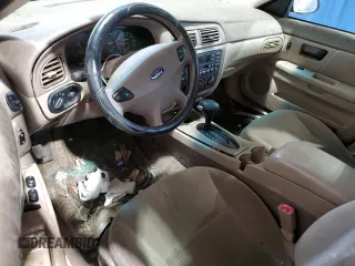 2003 Ford Taurus SE Standard z VIN 1FAFP532X3A195612, wystawiony jako Copart lot #54016645 z przebiegiem 143 168 mil mil oraz Szkoda całkowita • Salvage title. Historia ofert i sprzedaży dostępna na DreamBid. Obrazek 8.