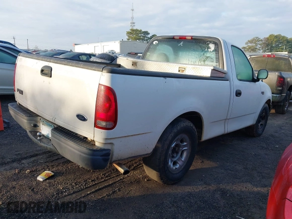 2002 Ford F-150 XL with VIN 1FTRF172X2NB18372, listed as a IAAI auction lot 41478280 with 240,736 mi miles. Bid and sale history available at carsss.com. Image 4.