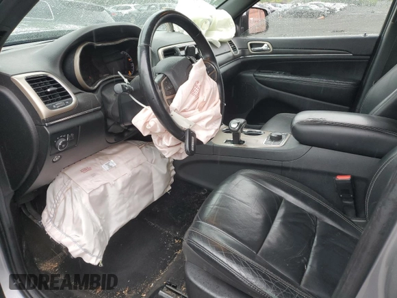 2014 Jeep Grand Cherokee Limited with VIN 1C4RJFBG9EC501136, listed as a Copart auction lot 59873595 with 203,819 mi miles and Salvage title. Bid and sale history available at DreamBid. Image 7.