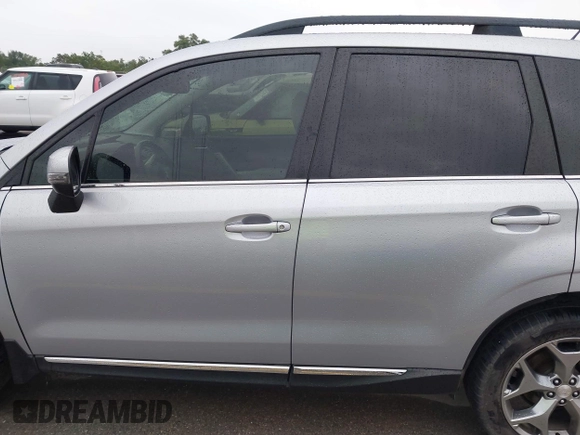 2015 Subaru Forester Touring with VIN JF2SJAUC8FH467730, listed as a IAAI auction lot 42403195 with 142,287 mi miles and . Bid and sale history available at DreamBid. Image 14.