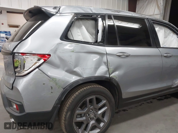 2023 Honda Passport EX-L with VIN 5FNYF8H56PB025612, listed as a IAAI auction lot 41937956 with 31,065 mi miles and . Bid and sale history available at DreamBid. Image 6.