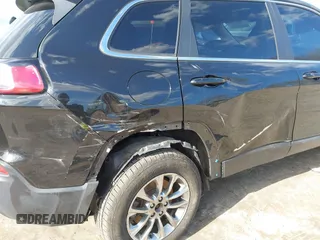 2020 Jeep Cherokee Latitude Plus with VIN 1C4PJMLB0LD591217, listed as a IAAI auction lot 41857544 with 102,704 mi miles and . Bid and sale history available at DreamBid. Image 6.